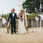 Bride and father walking down the aisle at a Long Island beach wedding