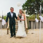 Bride and father walking down the aisle at a Long Island beach wedding